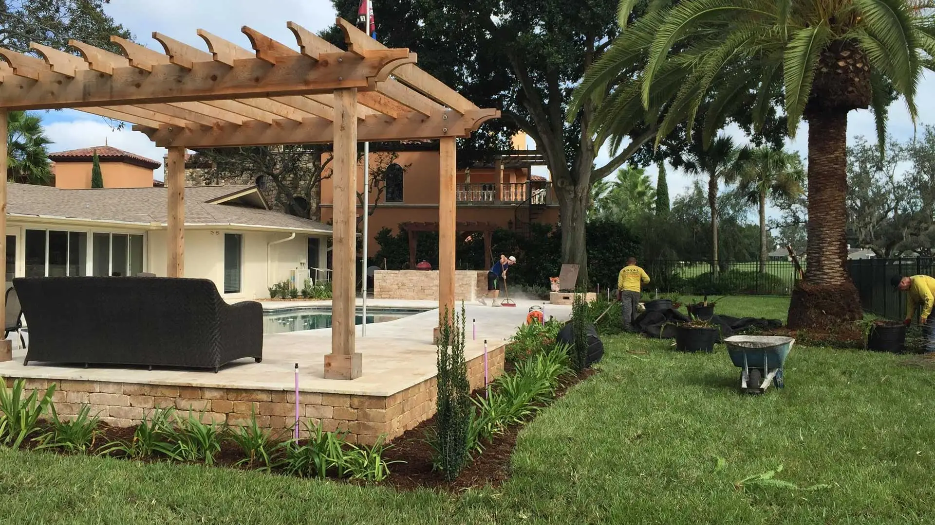 A fire pit with a seating wall around it and a paver patio that we recently installed in Winter Garden..