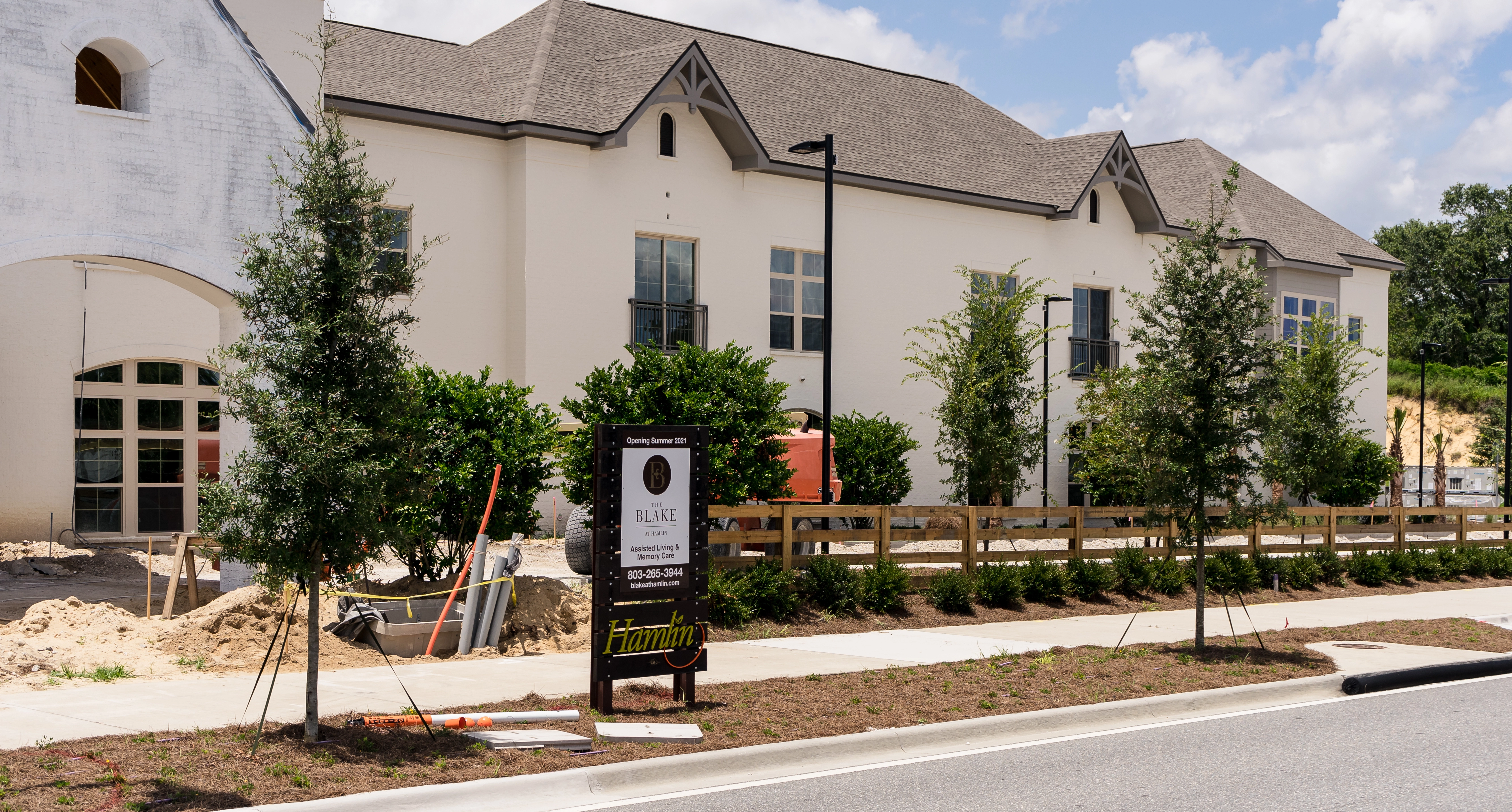 Our employees installing new landscaping at a commercial property in Clermont.